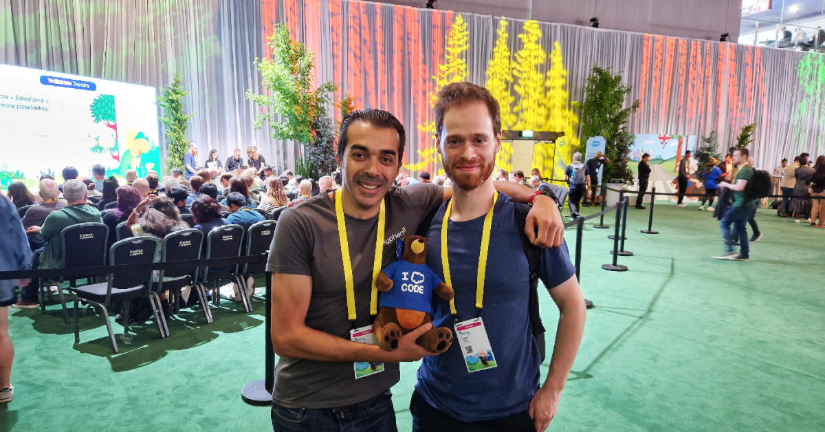 Two people smiling at Salesforce World Tour