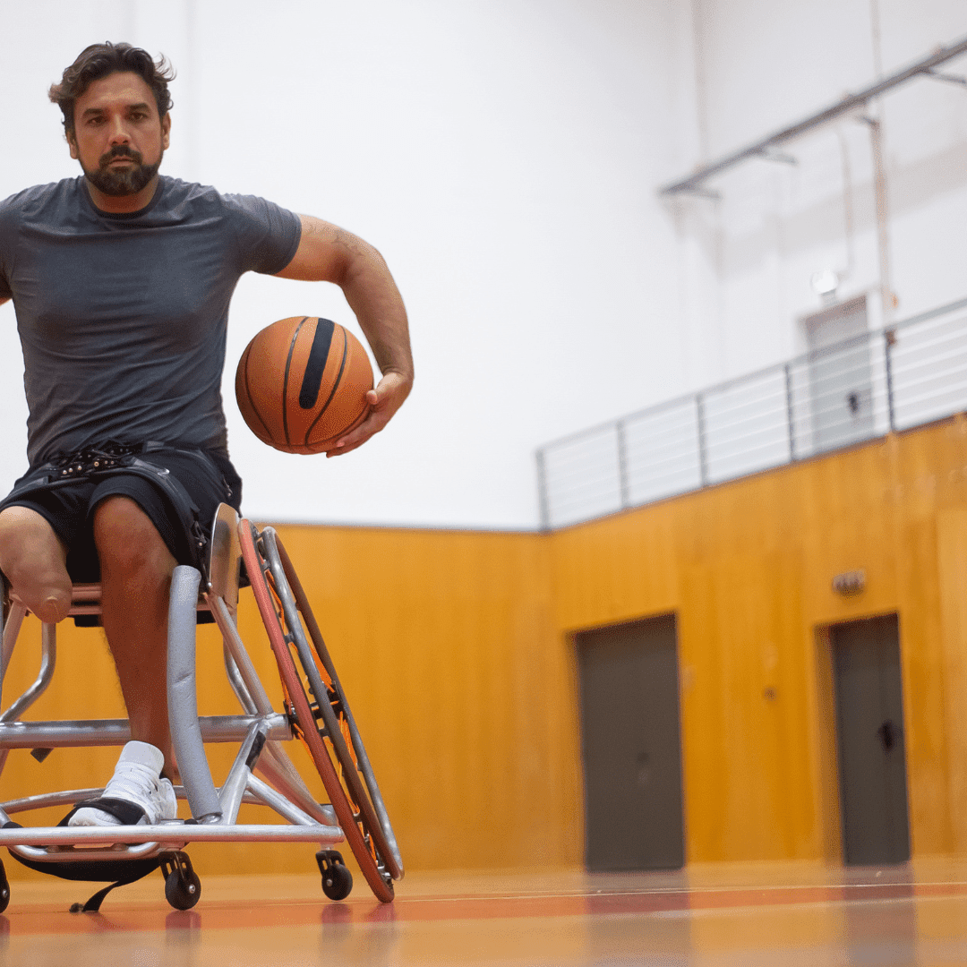 Male wheelchair user playing basketball