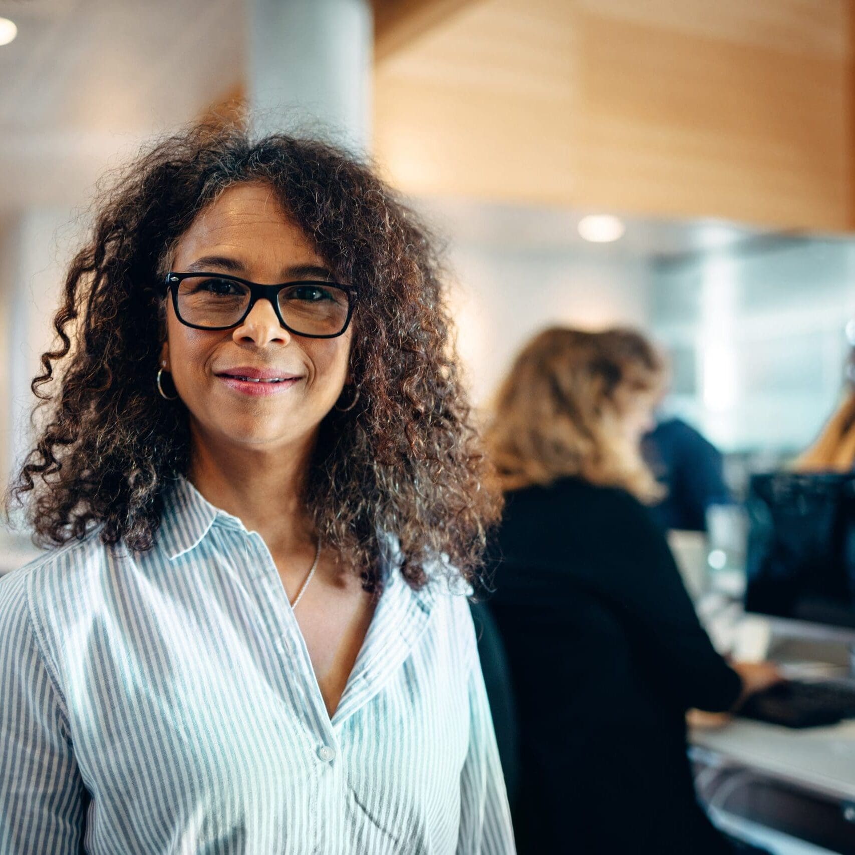 Portrait,Of,A,Confident,Businesswoman,Standing,In,Office.,Mature,Woman