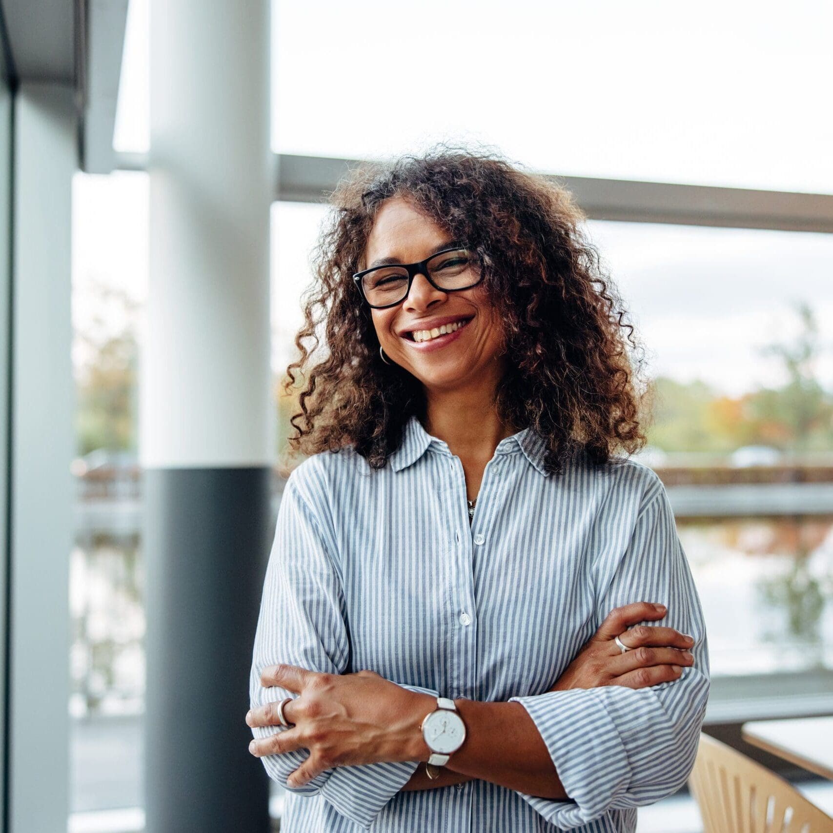 Portrait,Of,Successful,Female,Professional,With,Her,Arms,Crossed.,Smiling