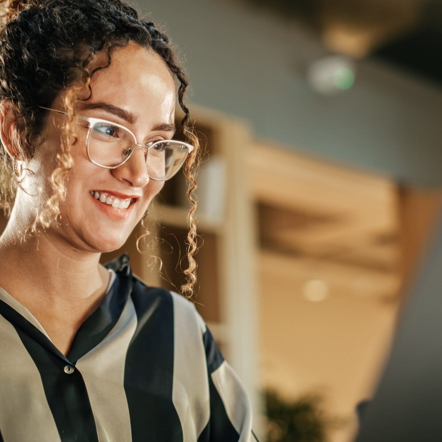 Portrait,Of,Hispanic,Creative,Young,Woman,Working,On,Laptop,In